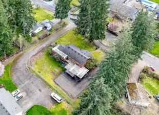 Backyard is fully fenced with chainlink. New $30K blacktop driveway and parking pad was poured just a few years ago! Driveway on side leads to the one neighbor behind you and trees on the other! No immediate neighbors on either side for additional privacy!