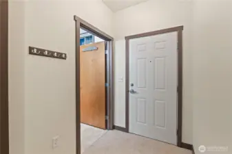 Front door area with bathroom on left