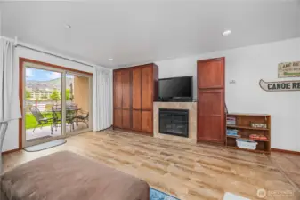 The room features a cozy electric fireplace to set the mood for cool evenings.