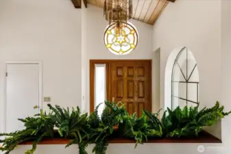 front door and foyer opens to living room