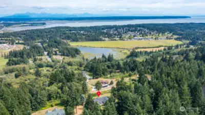 Views of Kristoferson Farm & Lake, Camaloch Golf Course, Port Susan and the Cascade Mountains.