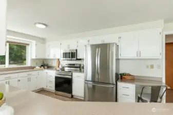 New stainless fridge, range and microwave with tons of storage space.