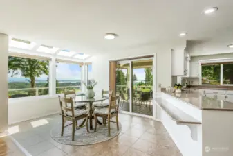 There is tremendous flexibility with the outdoor seating under the covered porch, informal seating right by the kitchen and a breakfast bar at the counter. Great spot for entertaining.