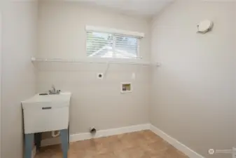 Upstairs laundry with utility sink