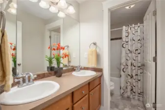Full hall bath upstairs with double sinks