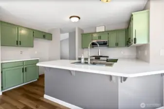 Kitchen with breakfast bar and lots of storage.