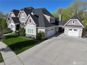 Double Car Attached Garage & Single Car Detached.  Driveway transforms into a Pickleball court
