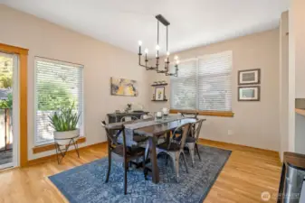 Beautiful light fixture adds a shining touch to this spacious dining room.