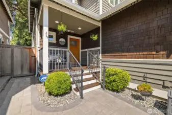 This sweet covered porch is the perfect morning coffee spot and creates and warm welcome.