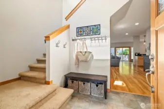 The vaulted entry is flooded with natural light.