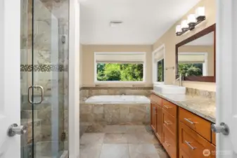 Beautiful tile throughout the primary bathroom.