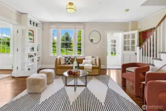 Original built-ins, hand-hewn banisters, and expansive windows tell stories of careful preservation and timeless design. From this vantage, you see not only the elegance within—but the borrowed landscape of Discovery Park, grounding daily life in beauty and breath.