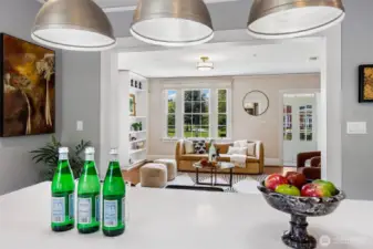 From kitchen to hearth, the home unfolds in effortless dialogue—spaces connected not only by thoughtful design, but by a shared spirit of welcome. Here, modern fixtures meet timeless form, offering a backdrop for both lively gatherings and solitary mornings steeped in quiet.
