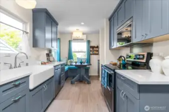Beautiful shaker style cabinetry in cheerful custom color creating wonderful kitchen atmosphere