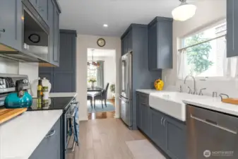 State of the art, fully equipped kitchen with high-end stainless-steel appliances, and porcelain tile flooring