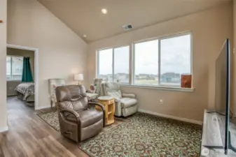 The primary suite sits behind the living room.