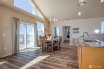 Kitchen is large and spills into ocean view dining space.