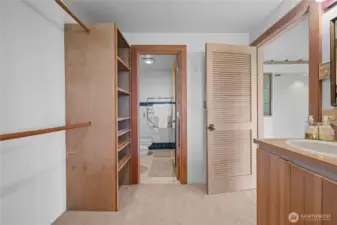 Primary bedroom walk in closet