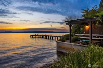 Enjoy a sunset kayak, paddle board or cold plunge from your private beach with newer bulkhead.