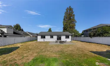 Fully fenced yard provides privacy and lots of space to make your own