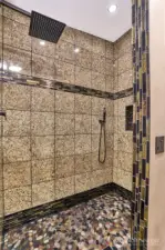 Primary walk-in custom shower.