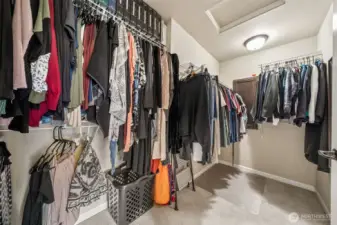 Master bedroom walk-in closet with plenty of storage.