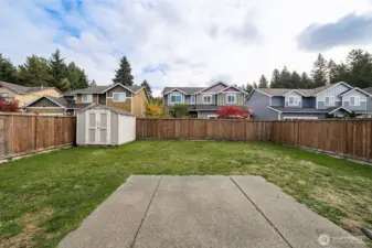 Huge fully fenced backyard with shed.