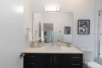 Full bath with a nice sized bathtub and a window.