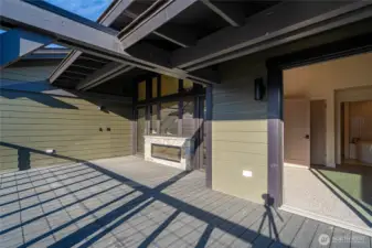 Spacious deck outside the living room lets you enjoy the outdoors any time of year with a double-sided fireplace. Pre-wired for ceiling patio heaters and pre-wired for your private hot tub addition.