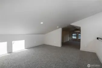 Bonus area in loft is perfect for an entertainment area.