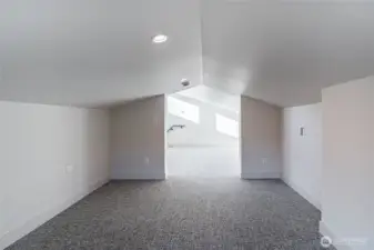 Sleeping area looking toward the bonus room in the loft.