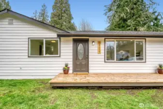 Welcome home to a light-filled, modernized beauty with undeniable curb appeal.    The custom front deck creates a warm, stylish entry—perfect for morning coffee, evening unwinding, or greeting guests with ease.