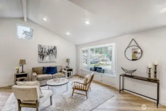 Sunlight fills every room with natural light while vaulted ceilings add a spacious, airy feel.