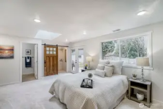 Retreat to a luxurious primary suite designed for comfort & style. This spacious haven features 2 generous closets with custom built in organizers, elegant touch, while French doors open directly to a private backyard deck, creating a seamless indoor-outdoor escape.