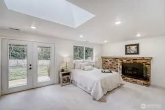 Retreat to a luxurious primary suite designed for comfort & style. This spacious haven features a gas fireplace adds a cozy, elegant touch, while French doors open directly to a private backyard deck, creating a seamless indoor-outdoor escape.
