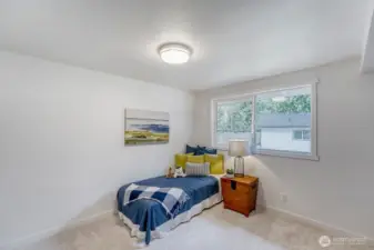 Bedroom #3 This light-filled bedroom offers a bright, airy atmosphere with generous windows overlooking the fully fenced backyard. Enjoy peaceful privacy and a serene view of the outdoor space, including a private DADU.