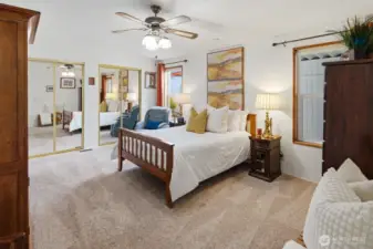 Luxurious primary bedroom boasts two large closets and a beautifully updated ensuite 5-piece bathroom