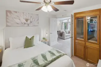 First of 2 guest bedrooms with double-door entry, built in armoire, and built-in desk area. This room would also make a perfect office or hobby room.