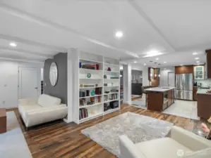 Expansive Open -Concept Elegance; this masterfully designed floor plan showcases a seamless flow between the intimate reading  lounge and the gourmet chef's kitchen, perfect for high end entertainment.