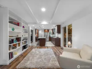 The heart of the home unfolds through the reading nook into this modern kitchen.