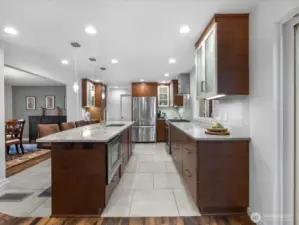 The chef's kitchen defines modern luxury with its quartz countertops, custom cabinetry and high-end SS appliances tailored to open concert entertaining.