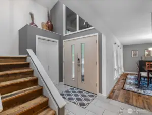 A striking staircase leads to the second level, where four well-appointed rooms await, (rare and well-sought feature)  enhanced by soaring ceilings and expansive windows that flood the space with natural light—creating an airy, uplifting ambiance that elevates everyday living.