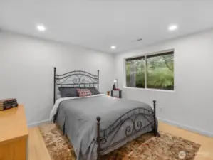 Bedroom #3 Serene retreat with bamboo flooring, forest views, modern recess lighting with brand new closet doors.