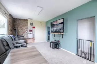 Upstairs is to the right.  Kitchen is straight ahead. Bedroom and bath off to the right.