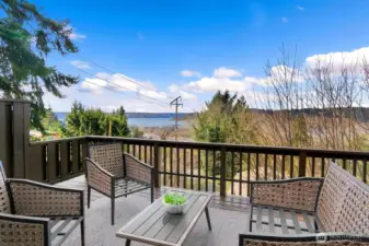 Entertaining-sized deck off main living areas, offers a place for outdoor entertaining and taking in the tranquil views