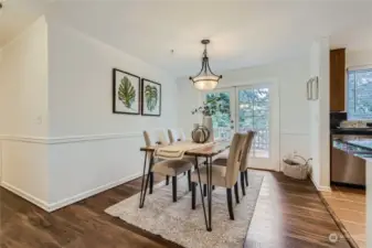 Dining room has upgraded French doors that lead to a spacious deck overlooking the back yard.