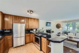 Updated kitchen features natural cherry cabinets, eating bar and upgraded stainless-steel appliances.