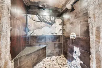 The shower features another imported natural stone mosaic of a well-known 1899 masterpiece by Alphonse Mucha called “Dusk.”
