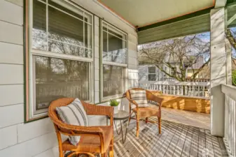 Sweet front porch that wraps around to the back yard