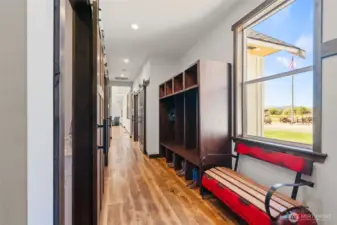 Entrance from the garage with powder room to your left